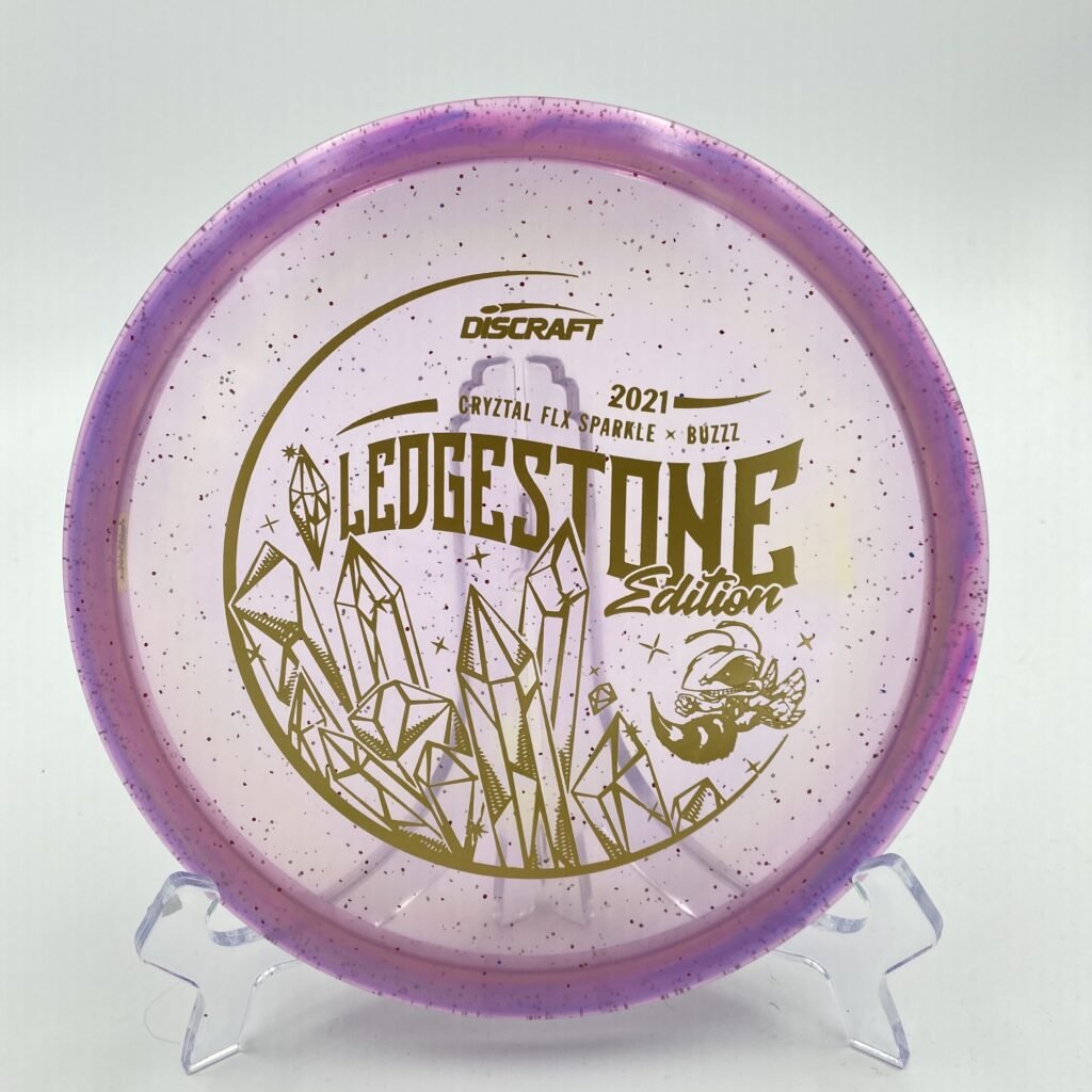 Top view of the translucent CryZtal FLX Sparkle Discraft Buzzz in durable plastic 2021 Ledgestone Edition with a stunning foil stamp.