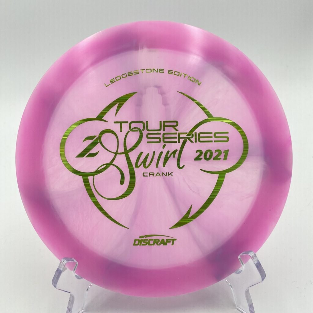 Top view of swirled blue Discraft Crank in Z plastic 2021 Ledgestone Tour Series Edition with silver foil stamp.