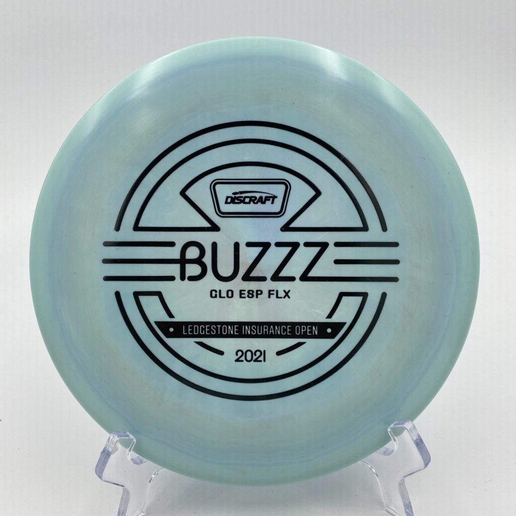 Top view of translucent Glo Discraft Buzzz in ESP FLX plastic 2021 Ledgestone Edition with silver foil stamp.