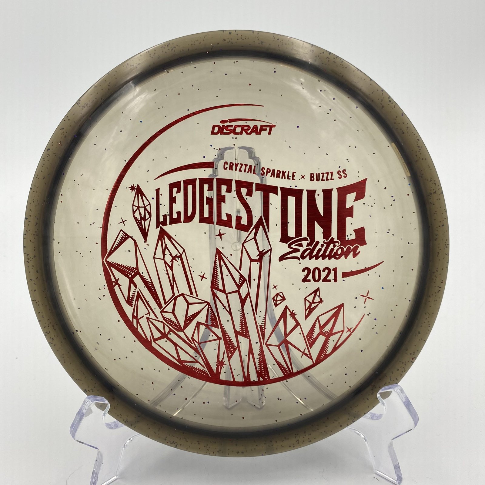 Top view of translucent blue Discraft Buzzz SS in CryZtal FLX Sparkle plastic - 2021 Ledgestone Edition with silver foil stamp.