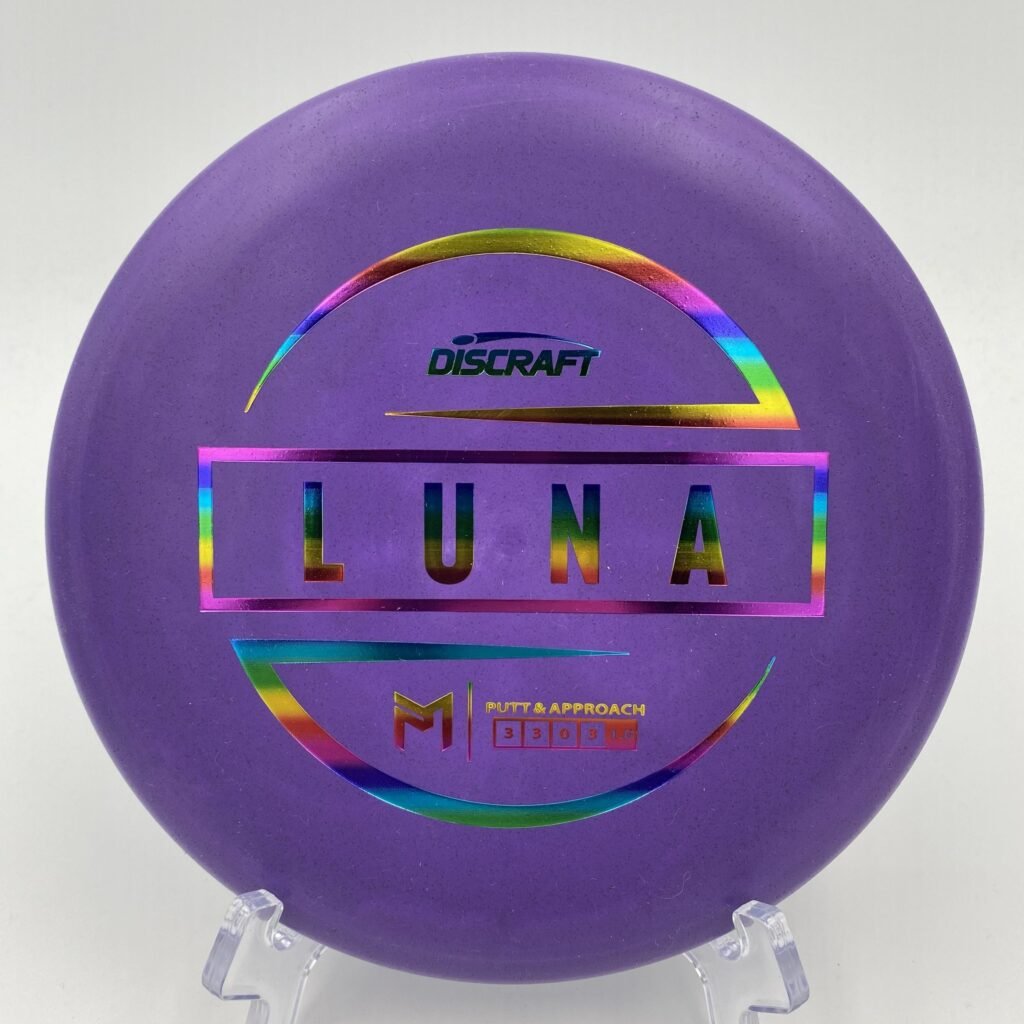 Top view of vibrant purple Discraft Luna in standard plastic with 6x Paul McBeth signature.