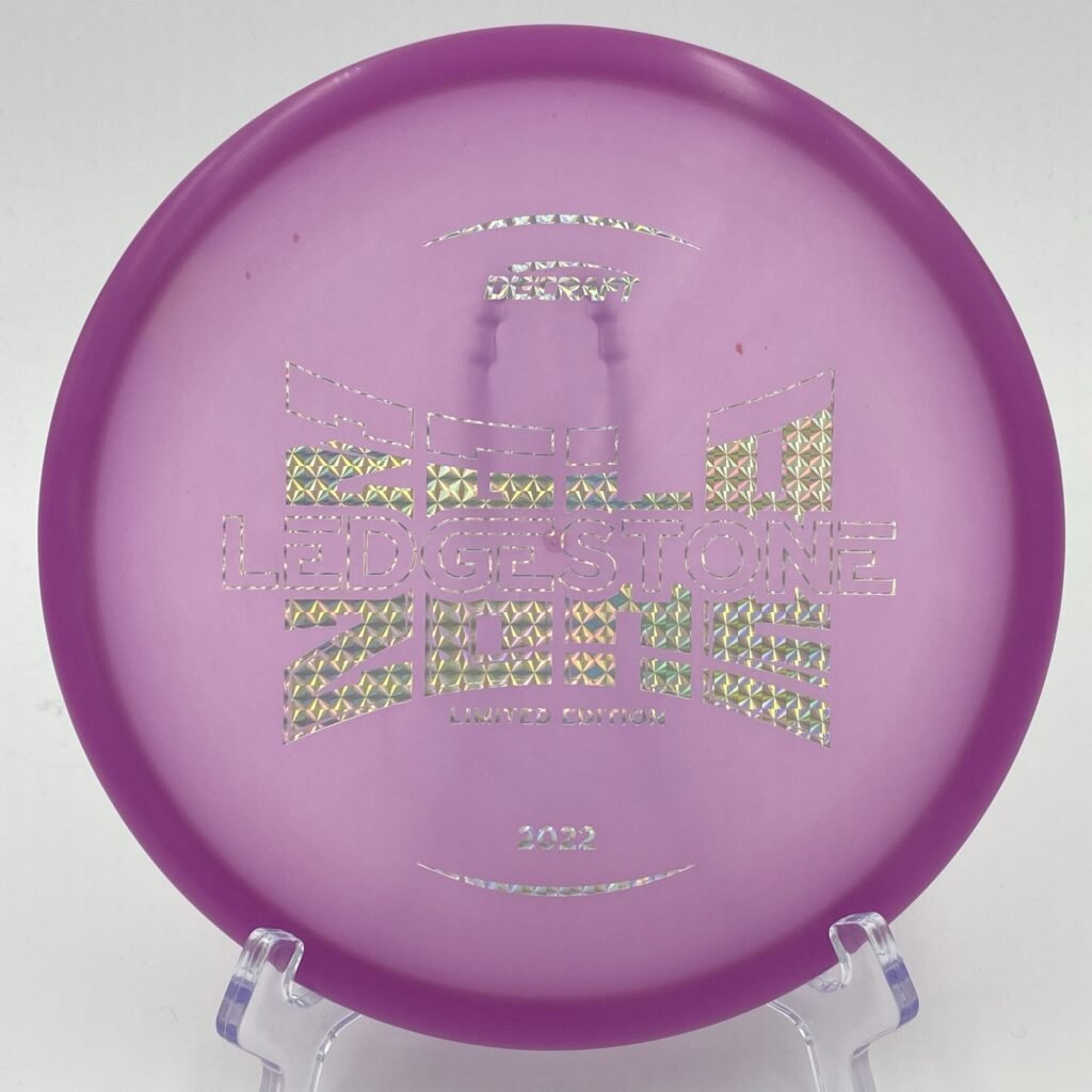 Top view of vibrant purple Discraft Z Glo Zone in Z Glo plastic - 2022 Ledgestone Edition with silver foil stamp.
