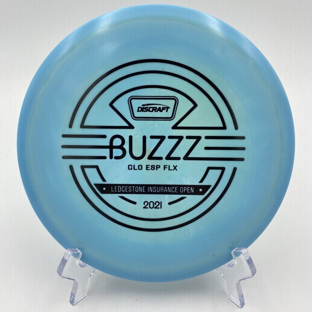 Top view of glowing orange Discraft Buzzz in ESP FLX plastic - 2021 Ledgestone Edition with vibrant foil stamp.