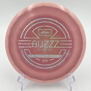 Top view of glowing green Discraft Buzzz in ESP FLX plastic - 2021 Ledgestone Edition with silver foil stamp.