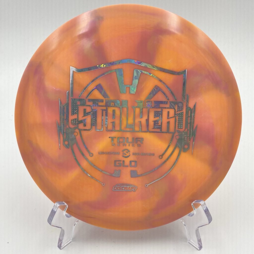 Top view of swirly GLO Discraft Stalker in ESP plastic - 2021 Ledgestone Tour Series Edition with vibrant color blend.