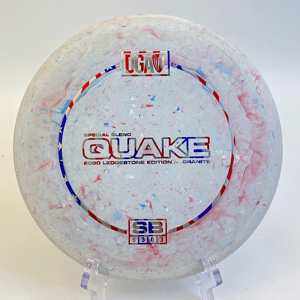Top view of marbled gray DGA Quake in Special Blend Granite plastic - 2020 Ledgestone Edition with colorful foil stamp.