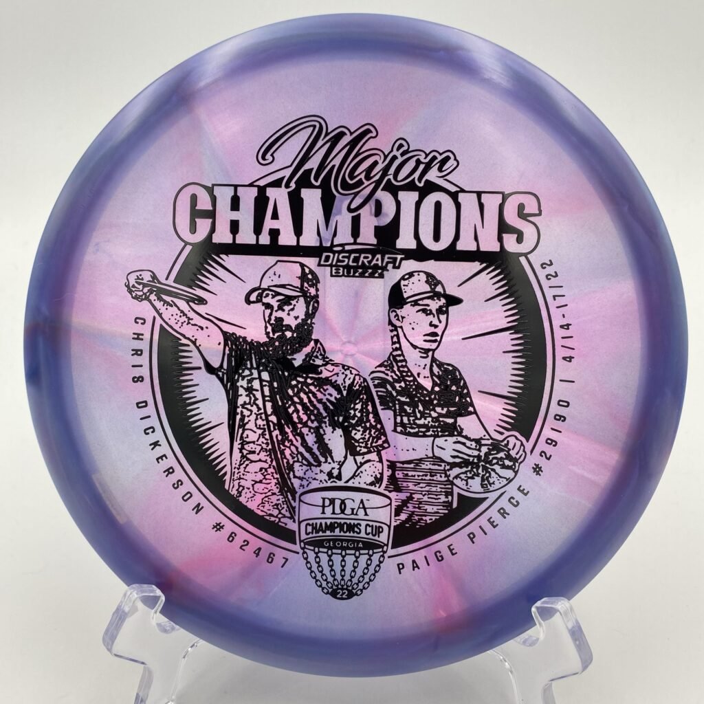 Main view of orange Discraft Buzzz in Z Swirl plastic Limited Edition 2022 Champions Cup.