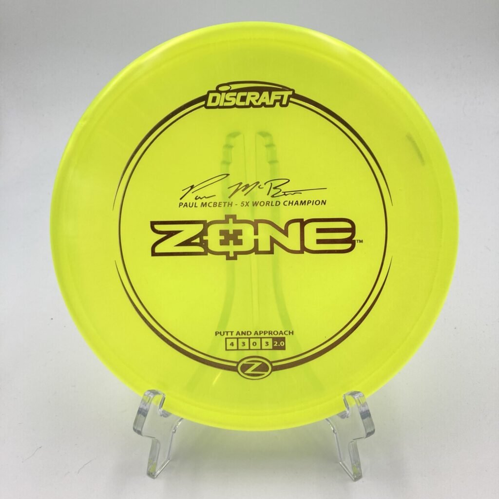 Top view of green Discraft Zone in Z plastic featuring the 5x Paul McBeth signature stamp.