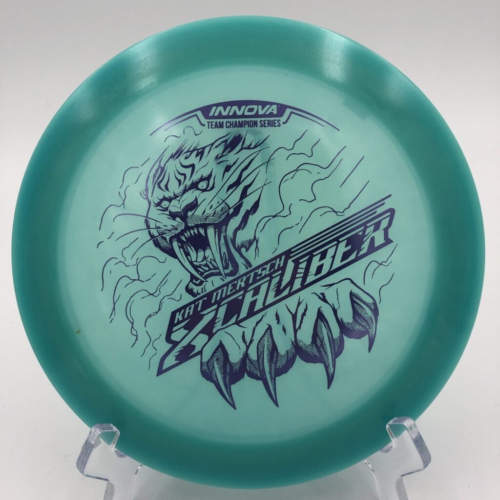 Top view of vibrant yellow-green Innova Xcaliber in Champion Color Glow plastic - 2022 Tour Series edition.