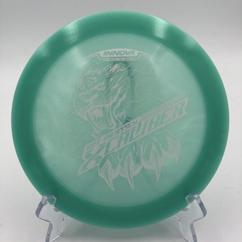 Top view of radiant green Innova Champion Color Glow Xcaliber - 2022 Tour Series with vibrant foil stamp.