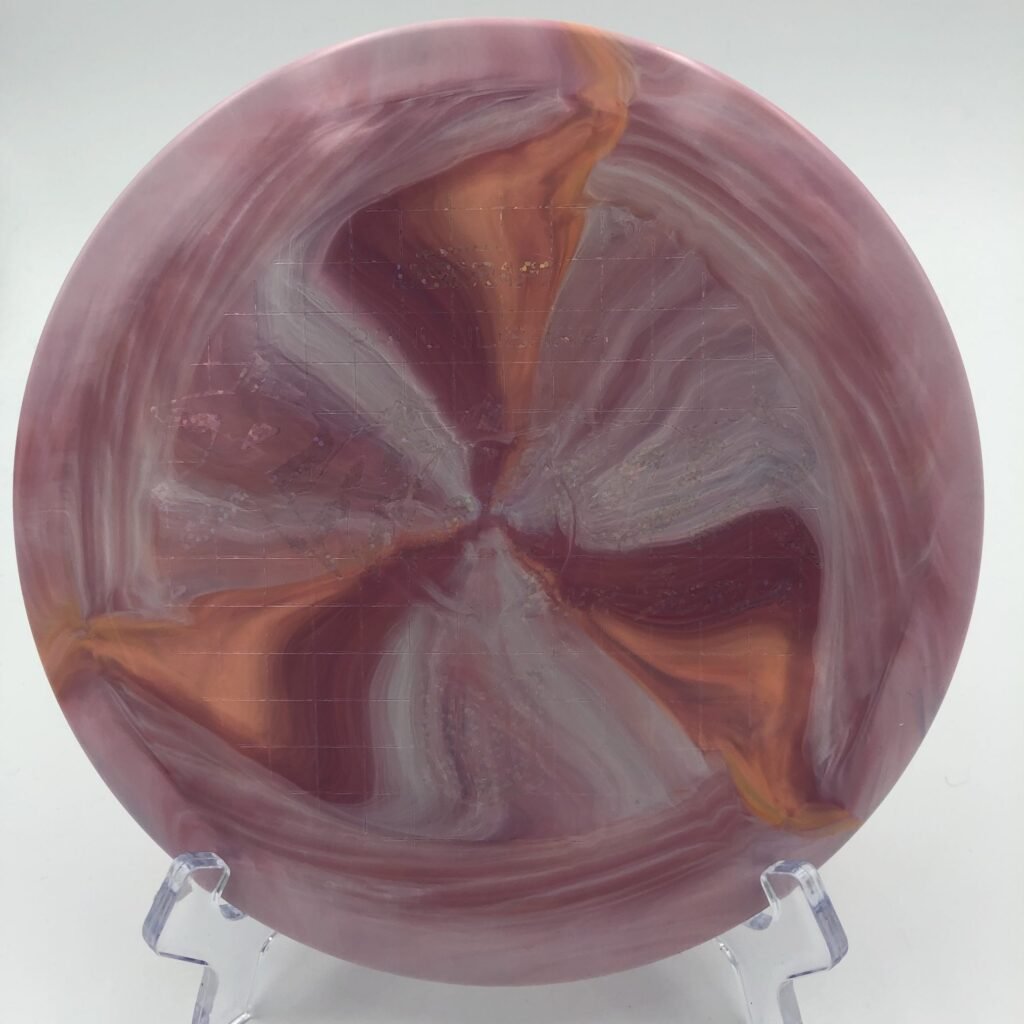 Top view of swirled yellow Discraft ESP Raptor in 2022 Paul Ulibarri Tour Series with vibrant patterns.