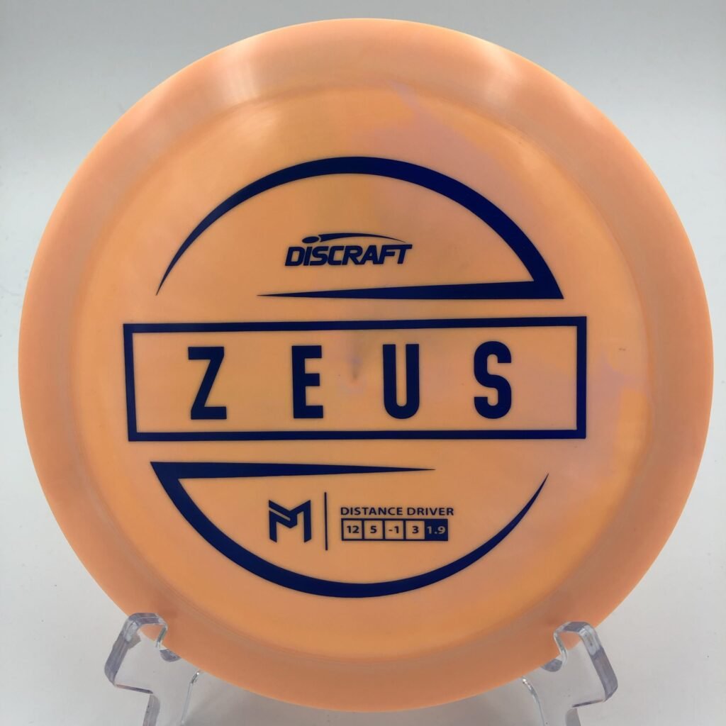 Top view of vibrant Discraft Zeus in ESP plastic featuring Paul McBeth’s signature series design.
