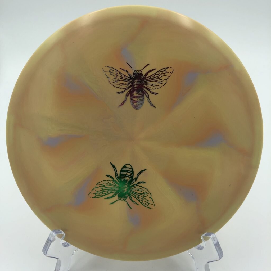 Top view of the colorful Discraft Wasp in ESP Swirl plastic from the Great Lakes Open with a unique tooled design.