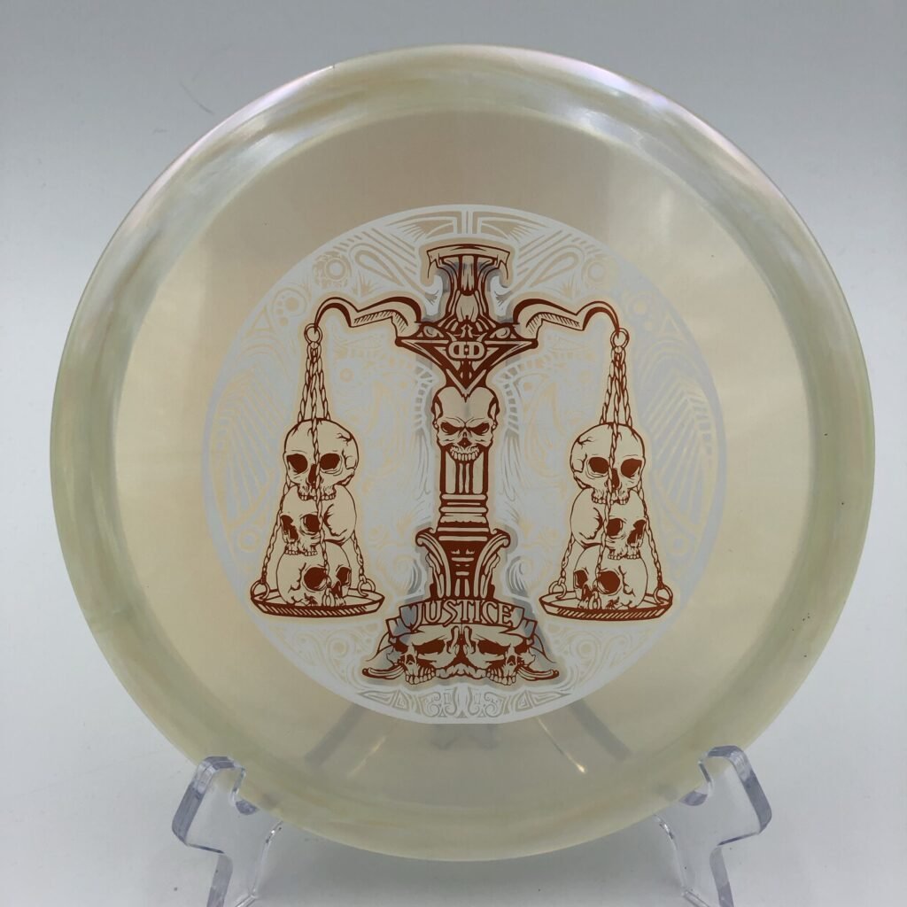 Top view of shiny green Dynamic Discs Lucid-X Chameleon Justice in special Scales of Justice run.