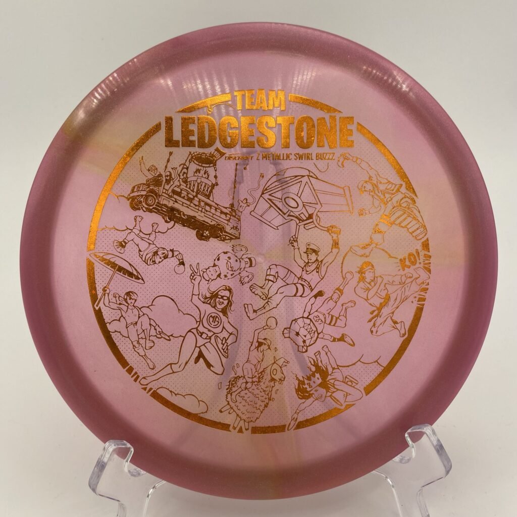Top view of vibrant Z Metallic Swirl Discraft Buzzz in 175-176g plastic - 2023 Team Ledgestone Fortnite Edition.