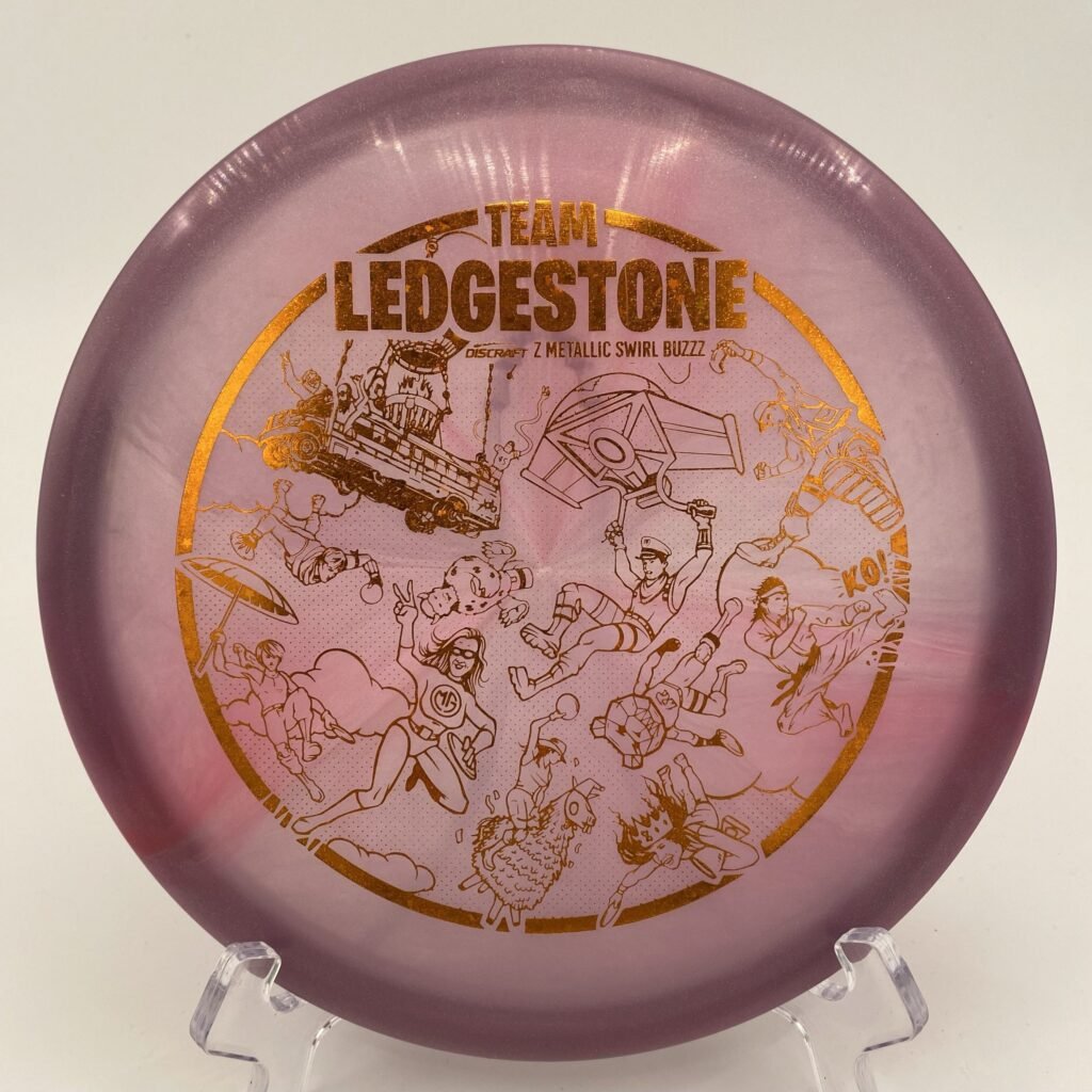 Top view of vibrant Z Metallic Swirl Discraft Buzzz in 2023 Team Ledgestone Fortnite plastic.