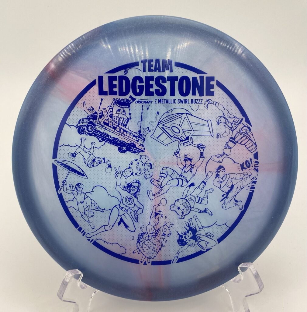 Top view of the colorful z metallic swirl Discraft Buzzz in Z plastic - 2023 Team Ledgestone Fortnite edition.