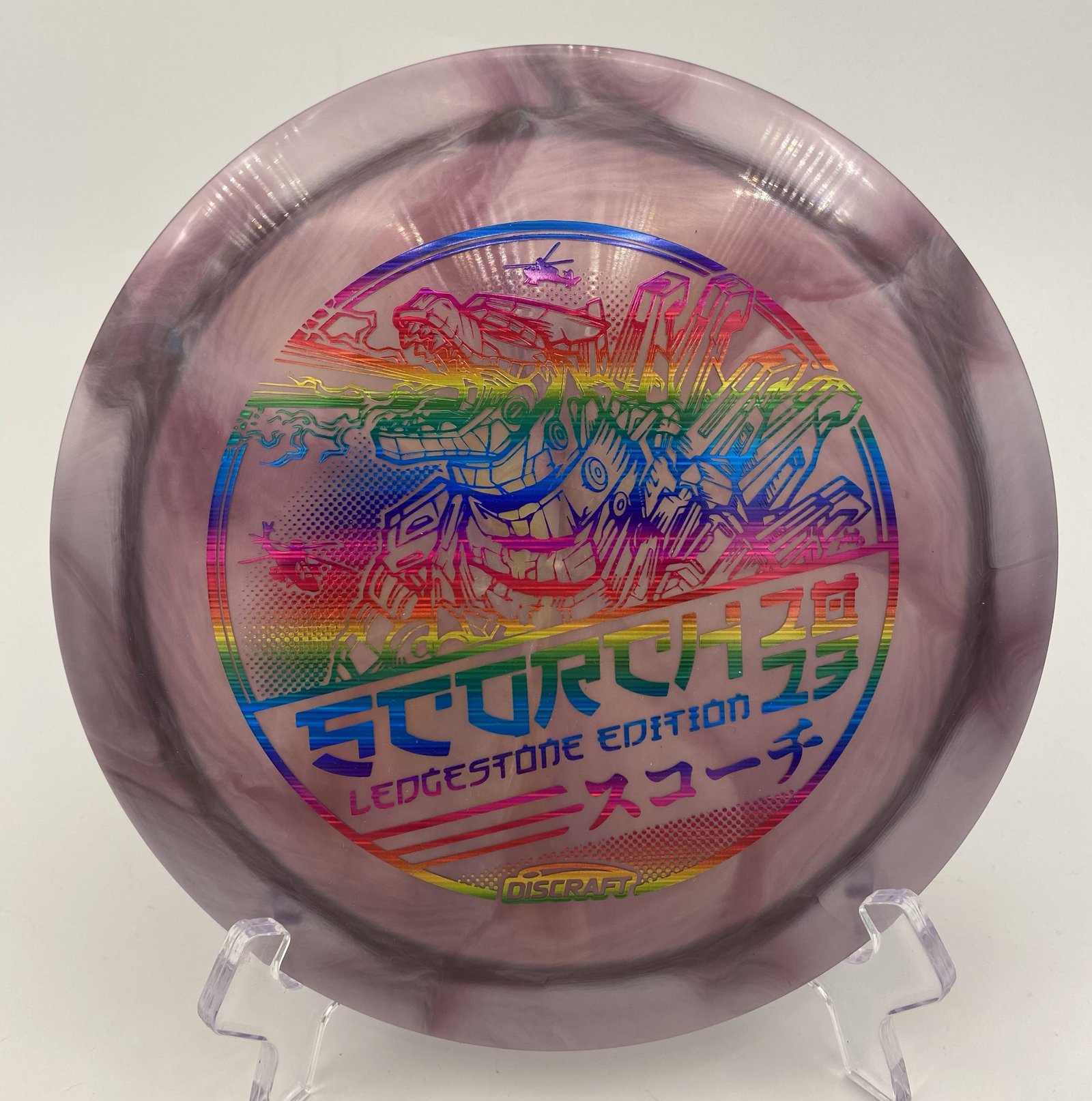 Top view of orange and black Discraft Scorch in Titanium plastic - 2023 Ledgestone Edition with vibrant swirl pattern.