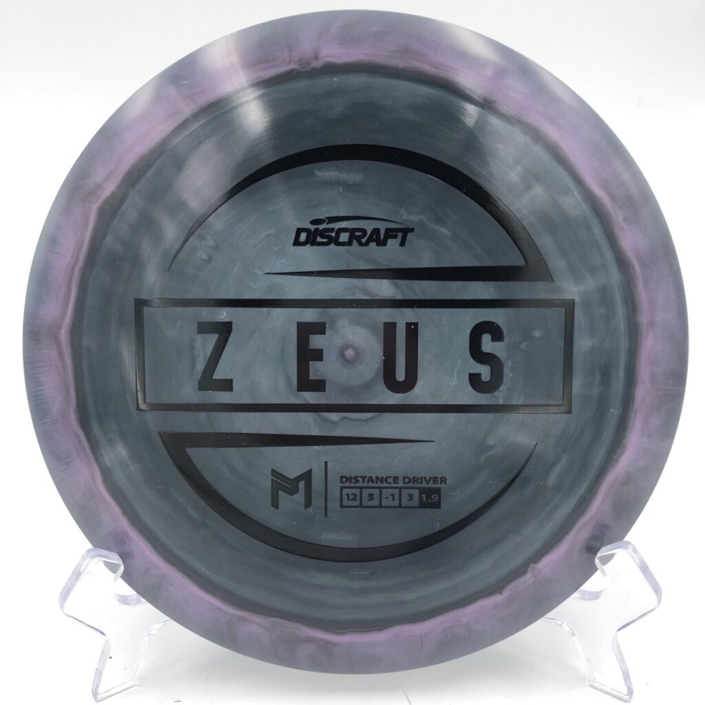 Top view of multicolored Discraft Zeus in ESP plastic with 6x Paul McBeth signature.