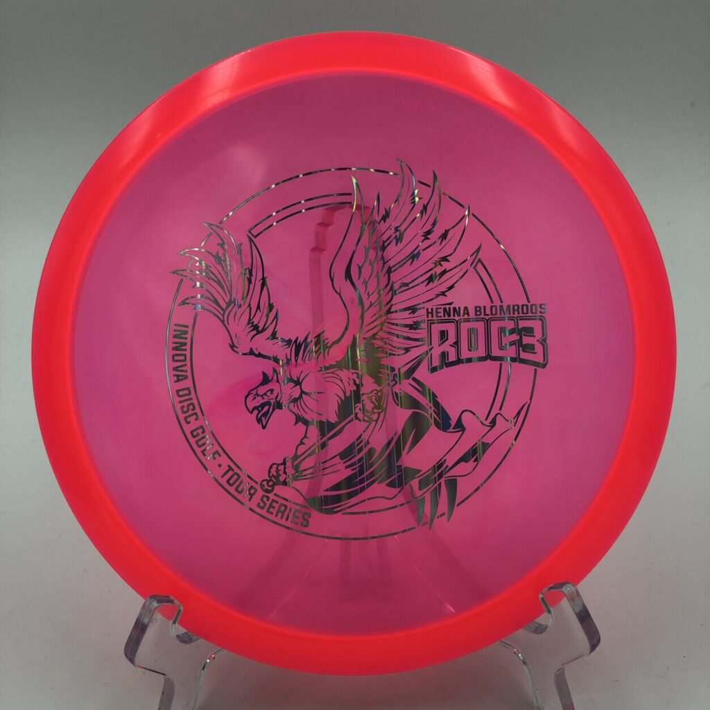 Top view of orange Innova Champion Roc3 in 2021 Tour Series plastic featuring Henna Blomroos' design.