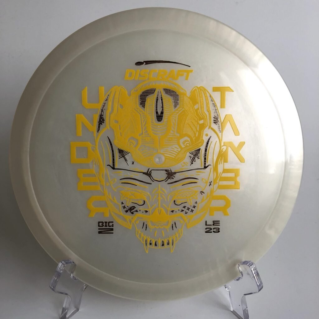 Top view of orange Discraft Undertaker in Big Z plastic - 2023 Ledgestone Edition with silver foil stamp.
