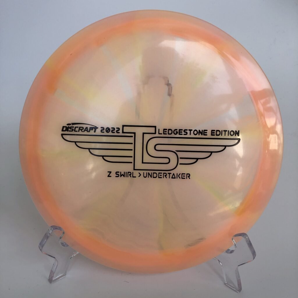 Top view of the vibrant Z Swirl Discraft Undertaker in Z Swirl plastic from the 2022 Ledgestone Tour Series.