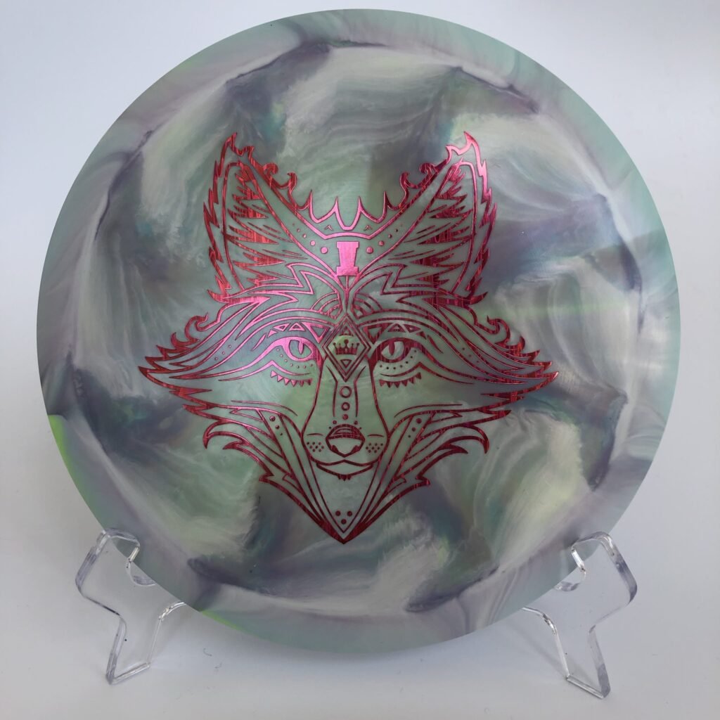 Top view of swirly ESP Discraft Heat in 167-169g plastic with Fox tour series stamp.