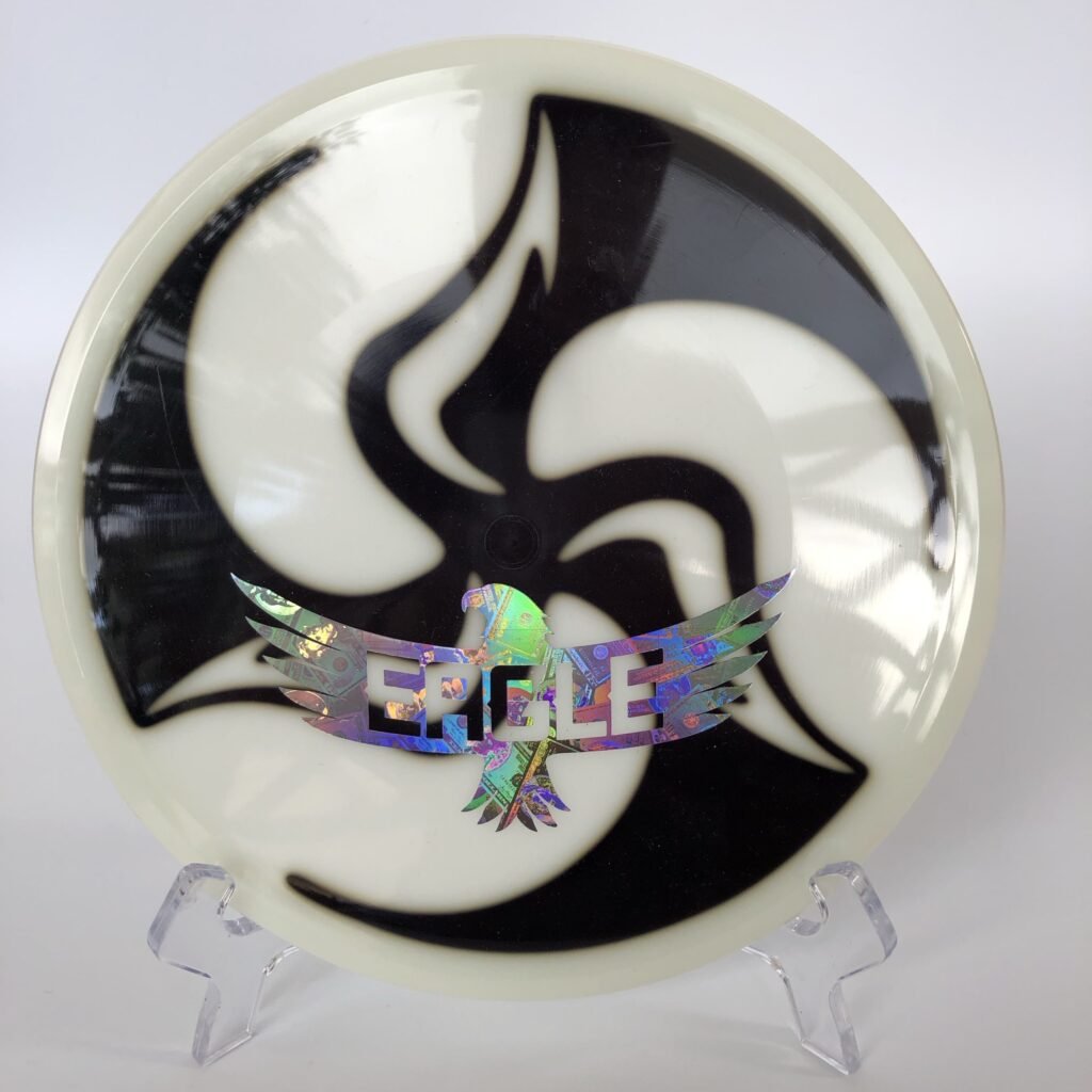 Main view of colorful Huk Dyed Discmania Neo Mutant with Eagle stamp.