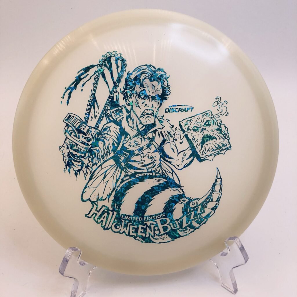 Main view of glowing green Discraft Buzzz in Nite Glo plastic Halloween 2023 edition.