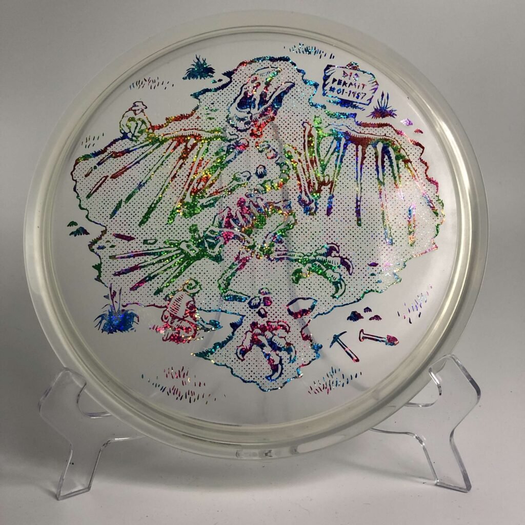 Top view of green Innova Roc in Champion plastic - 2021 USDGC Jurassic Roc with collector's edition certification.