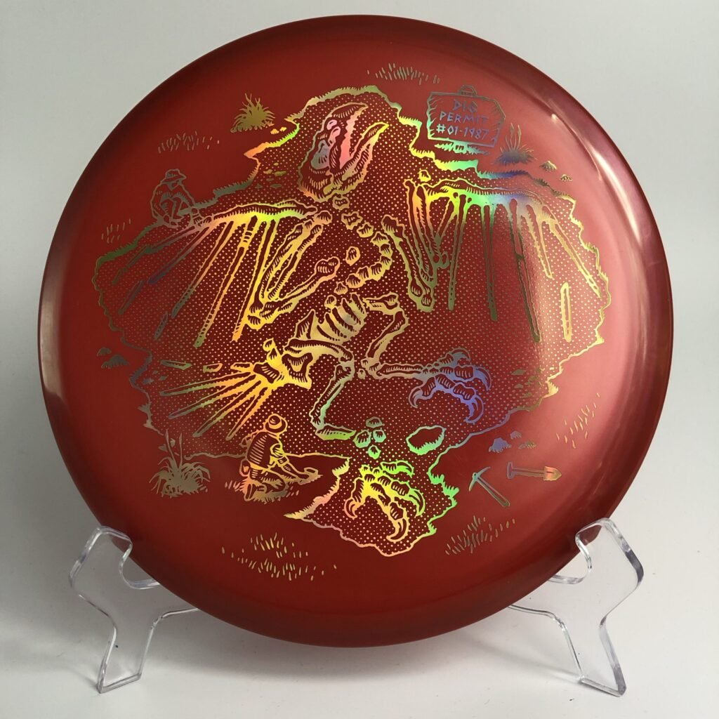 Top view of dark green Innova Champion Roc in 2021 USDGC Collector edition with vibrant artwork.
