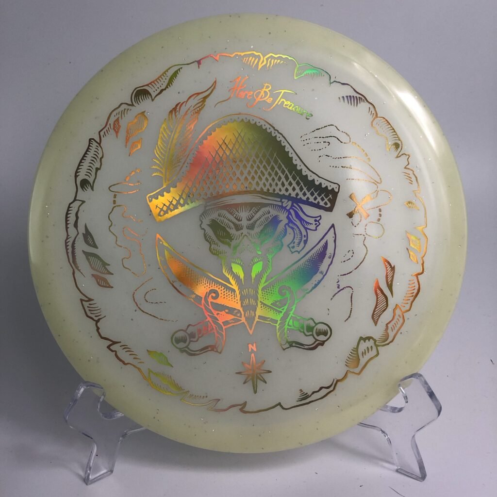Top view of luminescent green Innova Roc in Metalflake Glow plastic - 2021 Collector's Edition with unique Pirate Roc design.