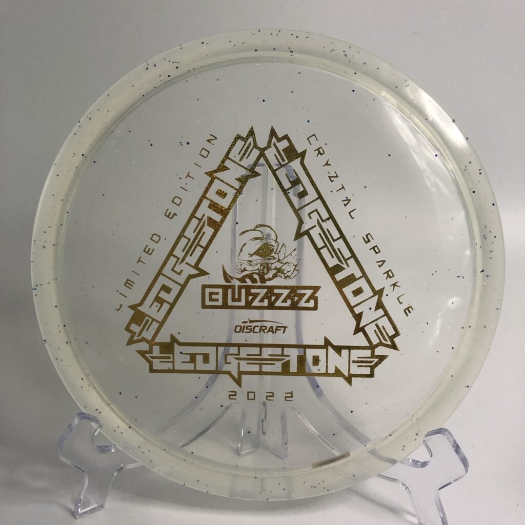 Top view of colorful Discraft Buzzz in CryZtal Sparkle plastic - 2022 Ledgestone Edition with vibrant foil stamp.