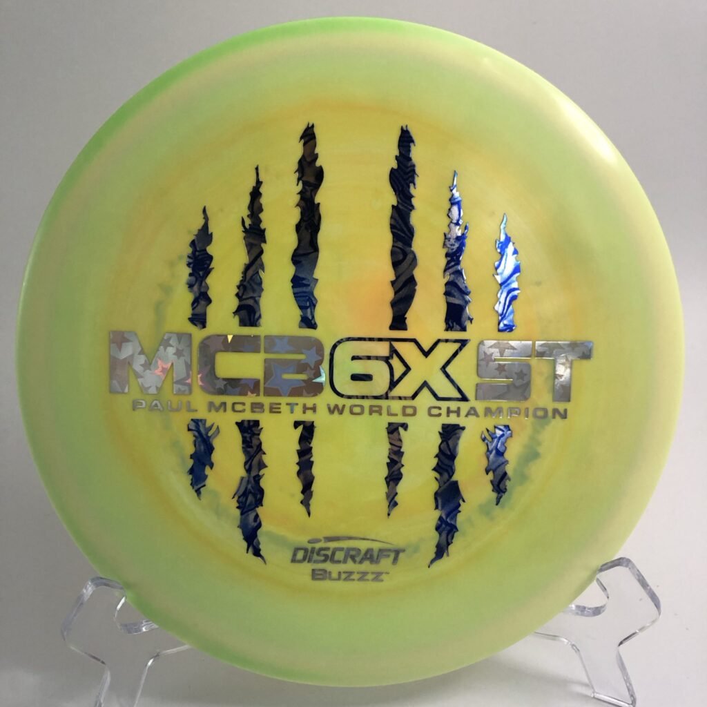Top view of the white Discraft ESP Buzzz in 6X Commemorative plastic with vibrant blue stamp.