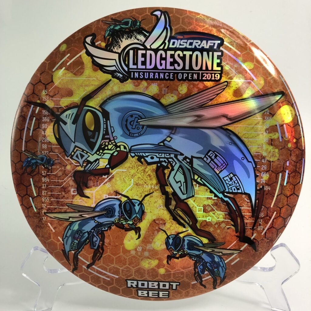 Top view of yellow Discraft Buzzz in ESP plastic 2019 Ledgestone Incurance Open edition with Robot Bee design.