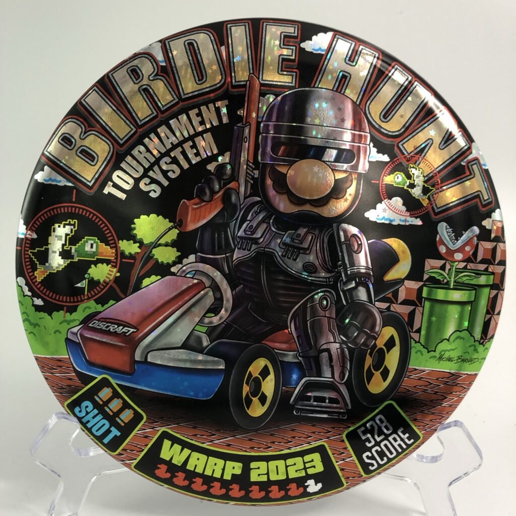 Top view of black Discraft Buzzz in ESP plastic - 2023 Michael Barnard Birdie Hunt Warp Edition.