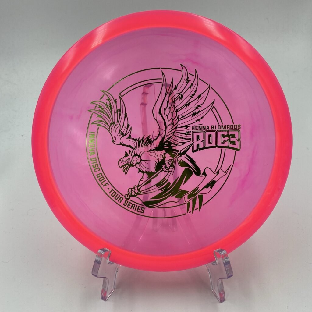 Top view of orange Innova Roc3 in Champion plastic 2021 Tour Series with unique henna design.