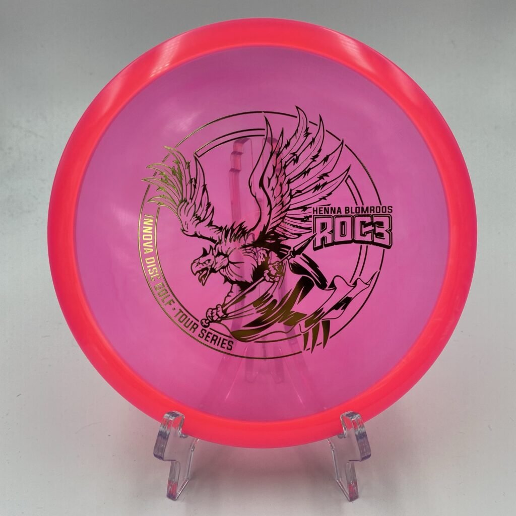 Top view of yellow Innova Roc3 in Champion plastic 2021 Tour Series with striking artwork.