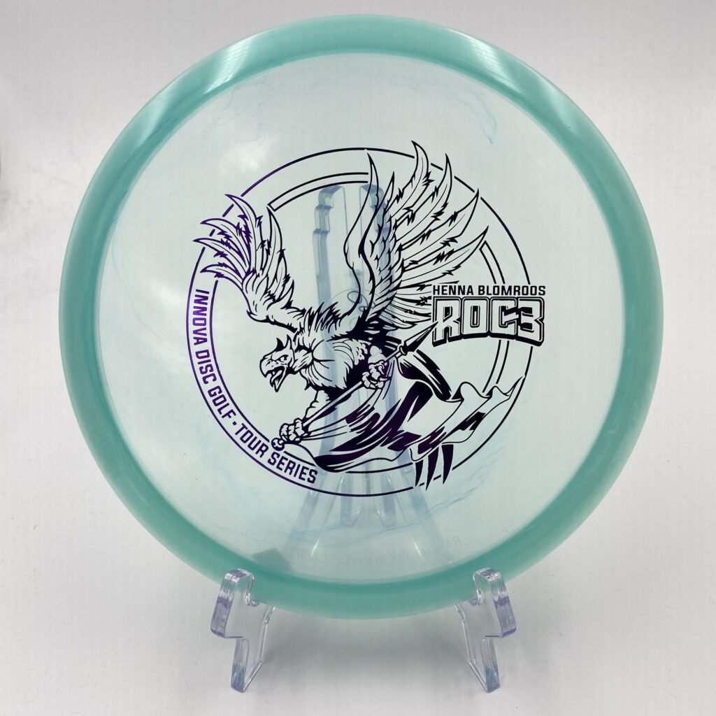 Top view of stunning Champion Innova Roc3 - Henna Blomroos Tour Series disc in vibrant graphic plastic.
