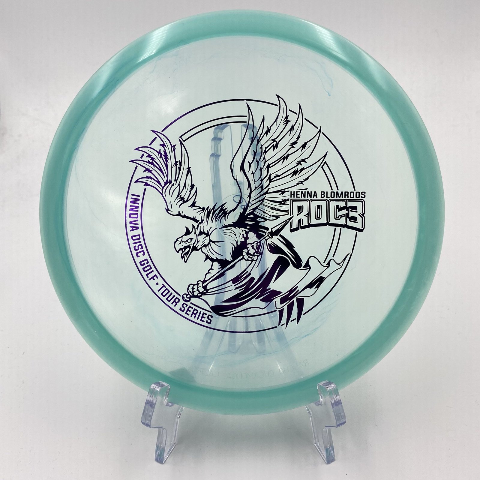 Top view of stunning Champion Innova Roc3 - Henna Blomroos Tour Series disc in vibrant graphic plastic.