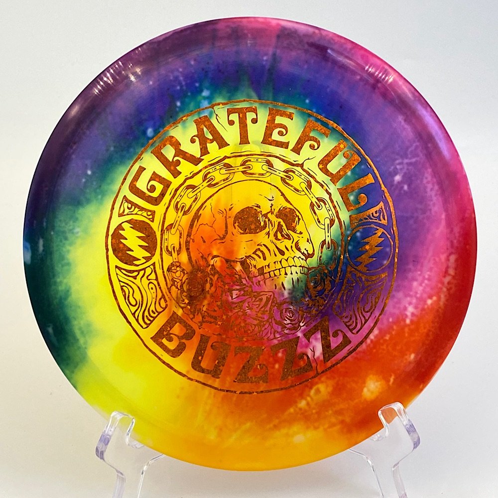 Top view of vibrant Z Fly Dye Discraft Buzzz in plastic featuring a unique Grateful Buzzz design.