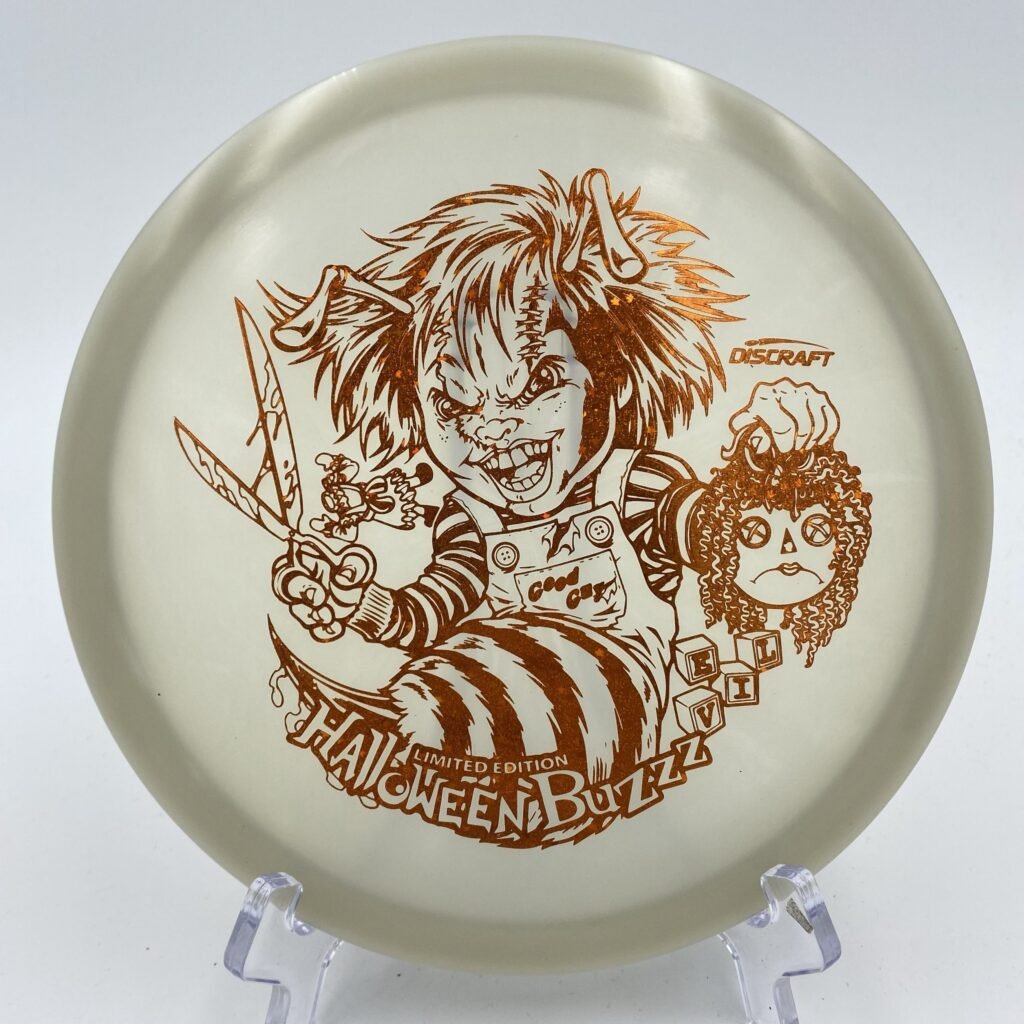 Top view of bright green Discraft Z Nite Glo Buzzz in Halloween 2022 Killer Doll plastic special edition.
