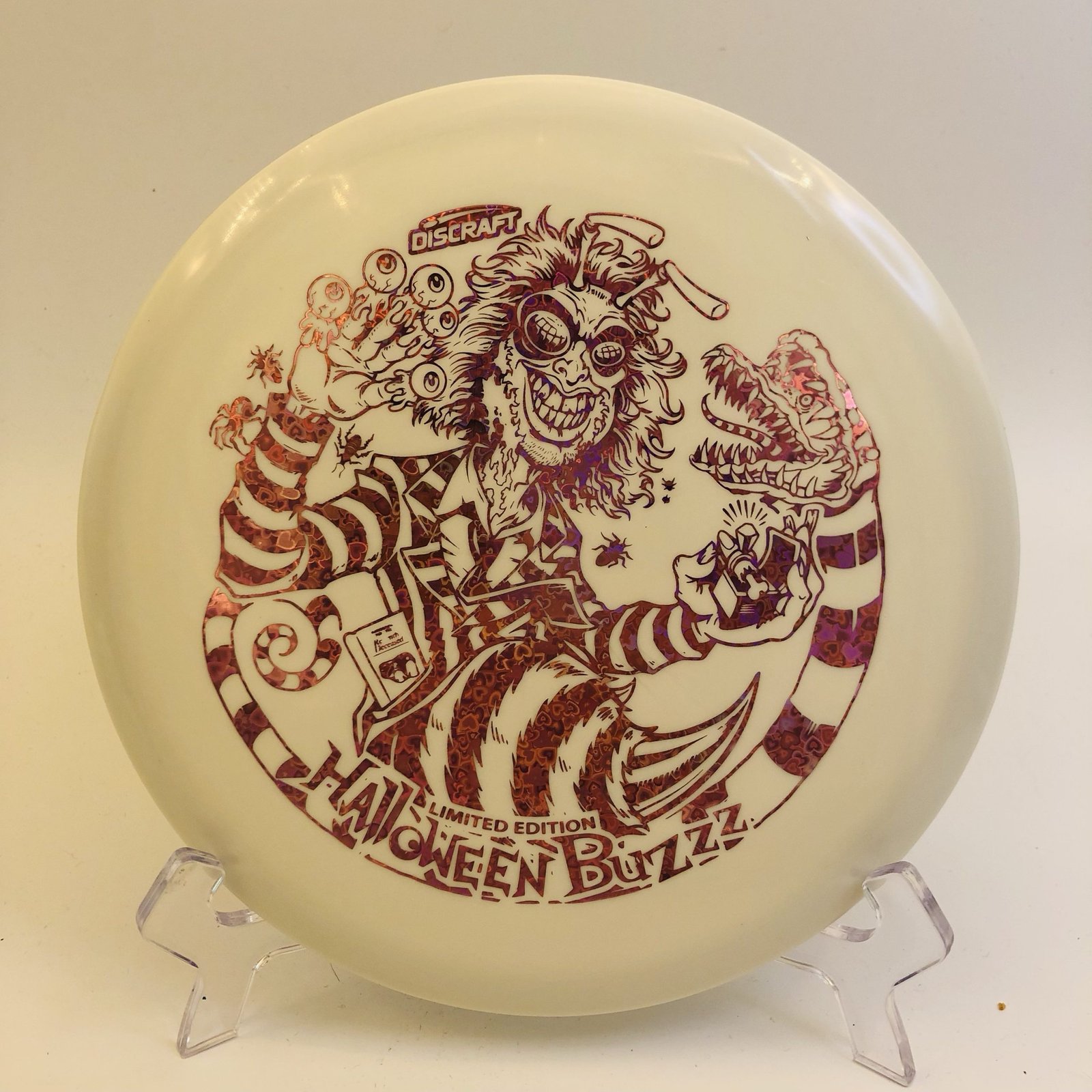 Translucent glow-in-the-dark Discraft Buzzz in Glo plastic - 2024 Halloween “Buzzzjuice” edition.