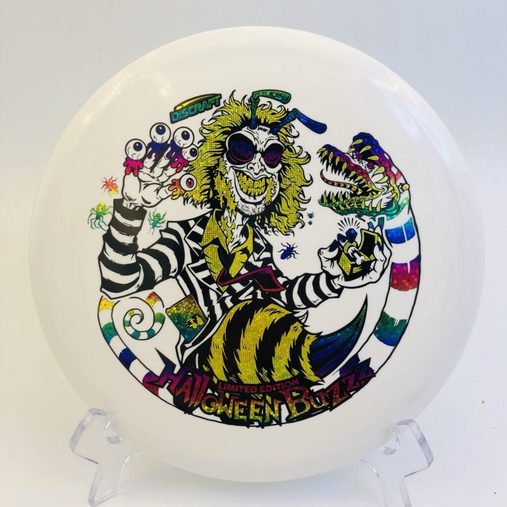Discraft Buzzz in Glo plastic 2024 Halloween Buzzzjuice edition with triple foil stamp.