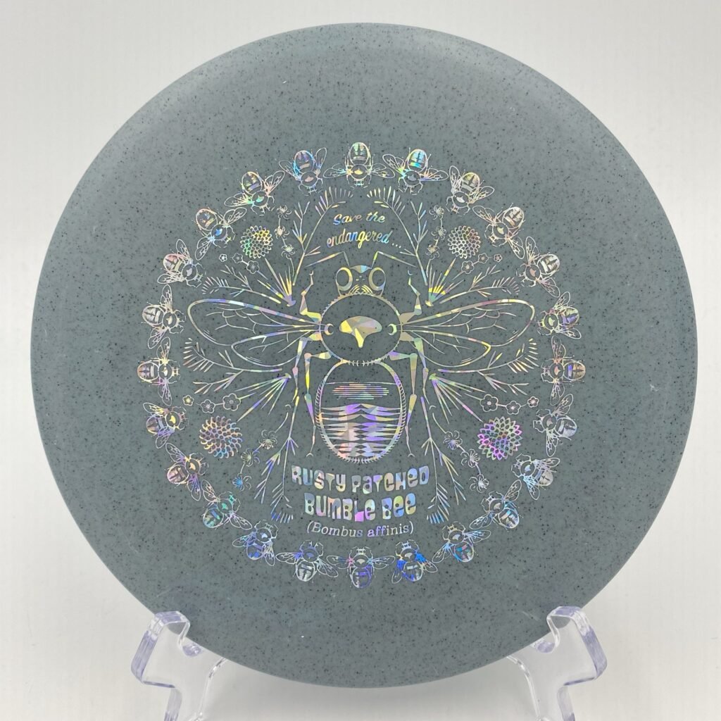 Top view of translucent Rubber Blend Discraft Buzzz SS in a special Rusty Patched Bumble Bee design.