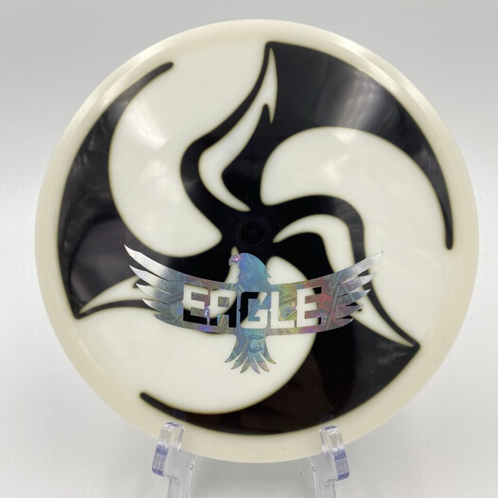 Top view of the colorful Discmania Neo Mutant featuring a unique Huk Dyed pattern with an eagle stamp.