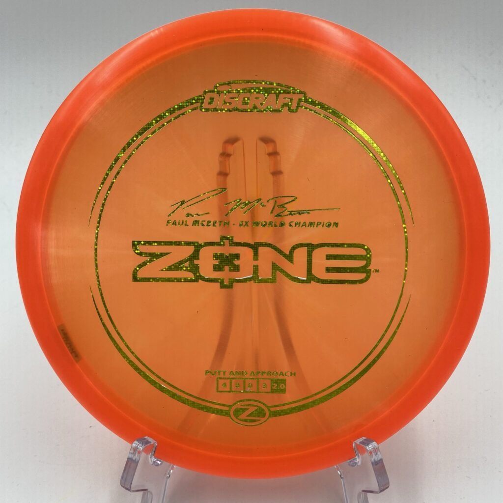 Top view of red Discraft Z Zone in 5x Paul McBeth plastic.