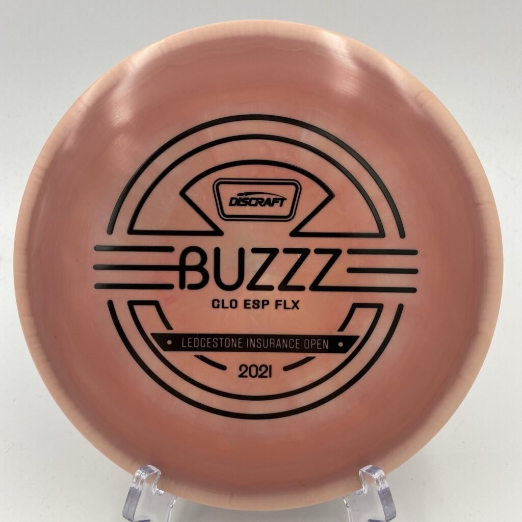 Top view of glow-in-the-dark green Discraft Buzzz in ESP FLX plastic - 2021 Ledgestone Edition with metallic foil stamp.