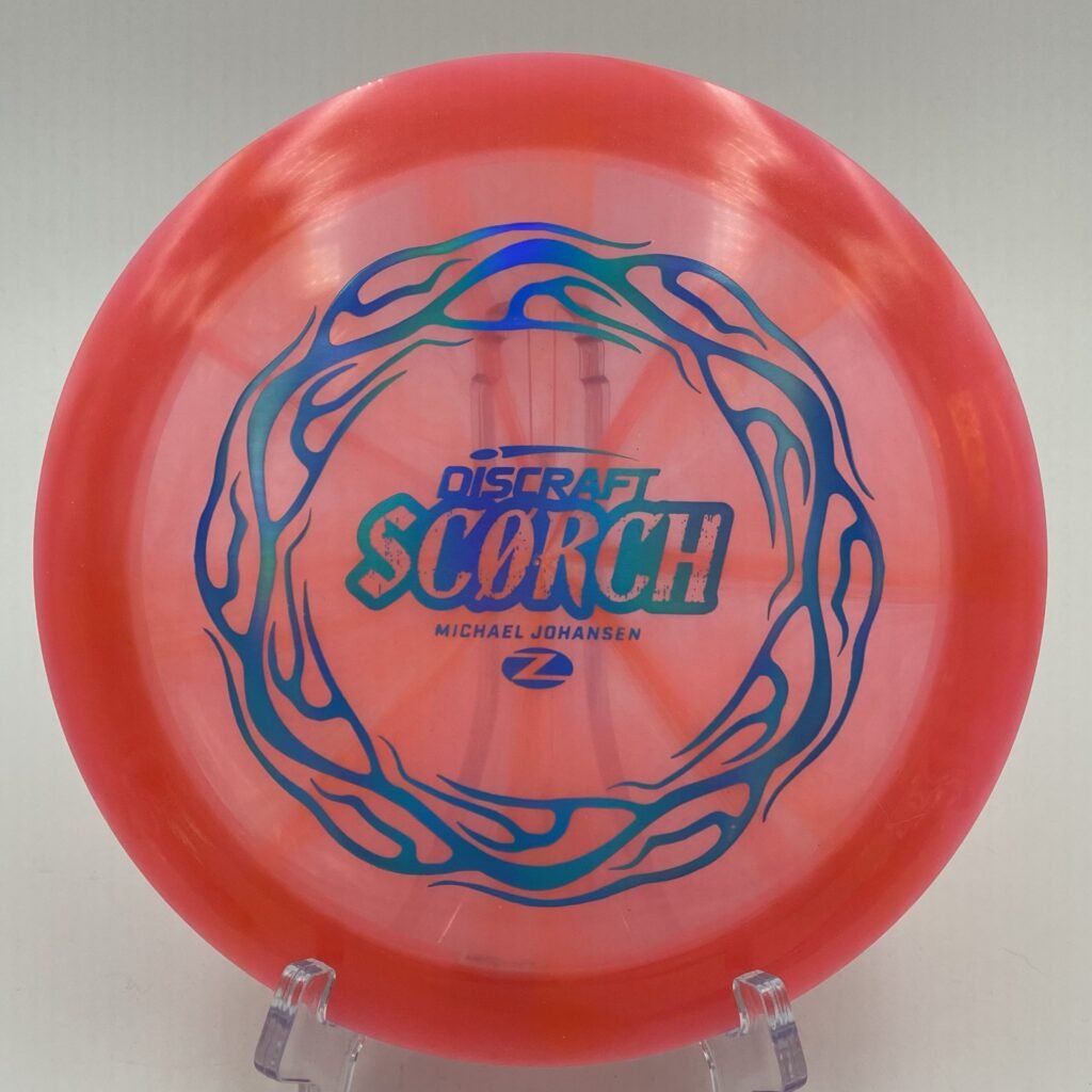 Top view of vibrant Z Swirl Discraft Scorch in Z plastic showcasing unique swirl patterns.