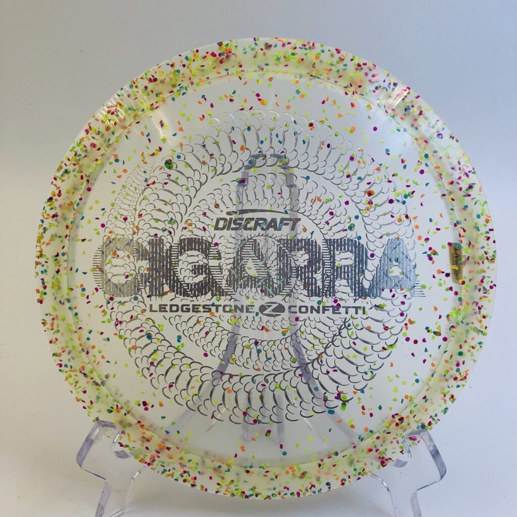 Discraft Cigarra in Z plastic Ledgestone 2025 Edition with a vibrant confetti design.